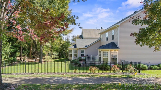 back of house with a yard