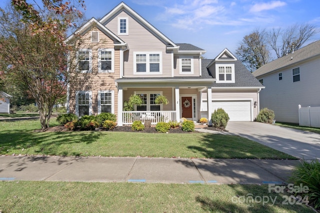 view of front of home with covered porch and a front yard