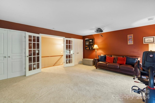 carpeted living room featuring french doors