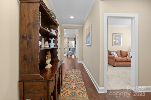 hallway featuring dark hardwood / wood-style flooring and ornamental molding