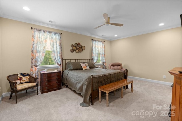 bedroom with ceiling fan, crown molding, light carpet, and multiple windows