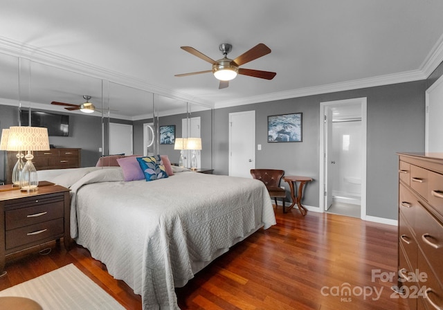 bedroom featuring ceiling fan, connected bathroom, crown molding, and dark wood-type flooring