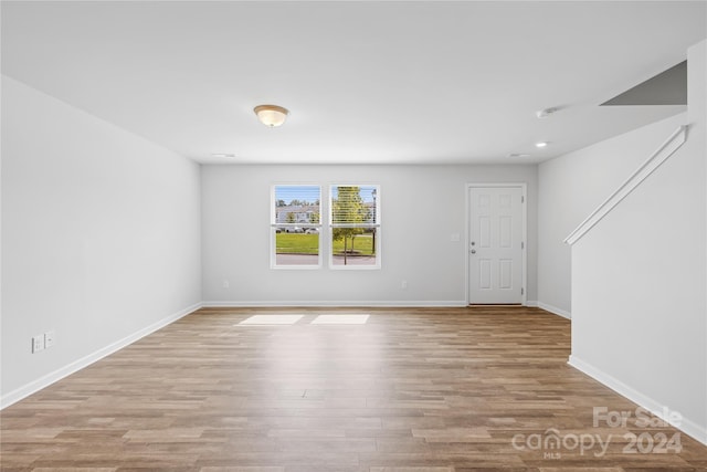 unfurnished room featuring light hardwood / wood-style floors