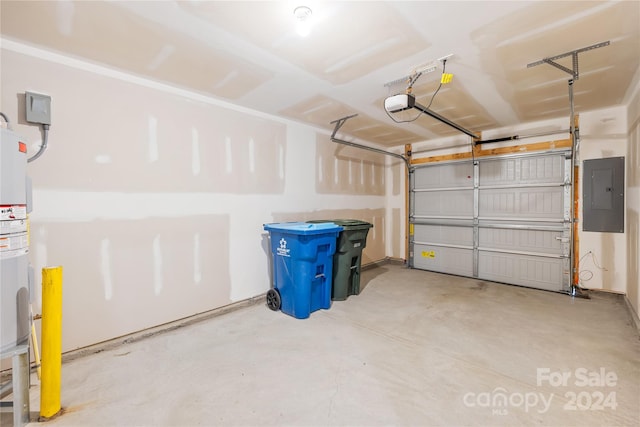 garage with a garage door opener and electric panel