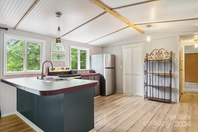 kitchen featuring stainless steel fridge, light wood-type flooring, decorative light fixtures, and vaulted ceiling