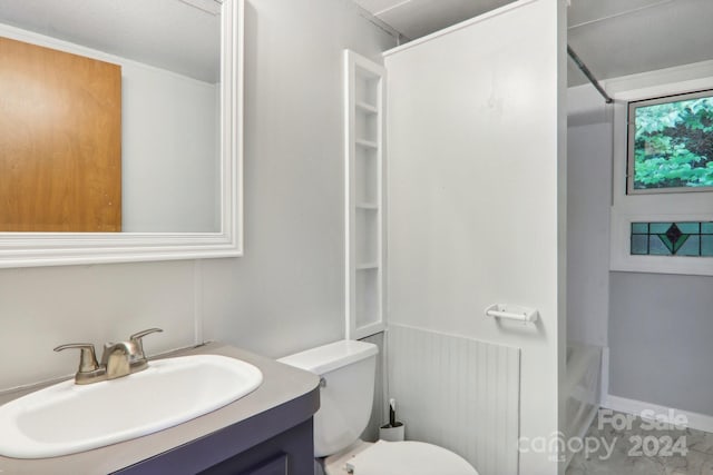 full bathroom with bathing tub / shower combination, vanity, and toilet