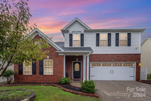 front of property with a garage