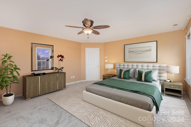 carpeted bedroom with ceiling fan