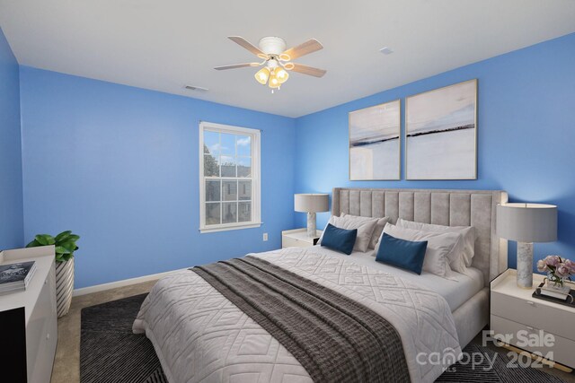 bedroom featuring ceiling fan and carpet floors