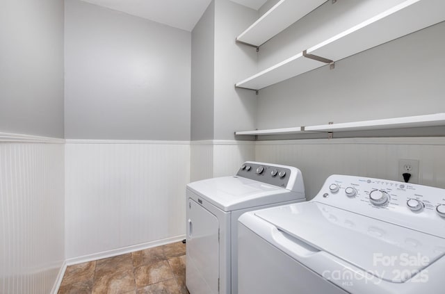 laundry room featuring washing machine and clothes dryer