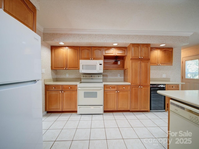 kitchen featuring wine cooler, white appliances, ornamental molding, and light tile patterned floors