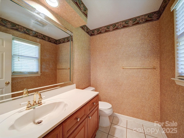 bathroom featuring tile patterned floors, toilet, and vanity