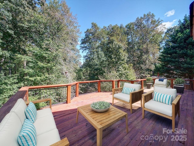 wooden terrace featuring an outdoor hangout area