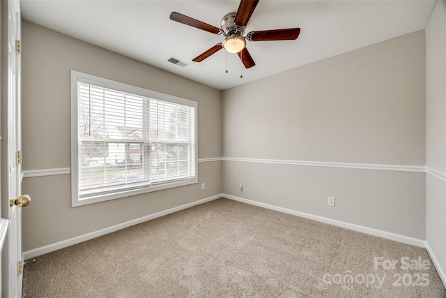 carpeted empty room with ceiling fan