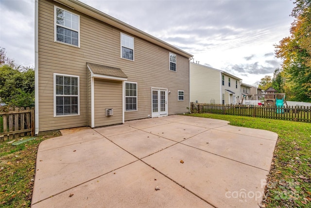 rear view of house with a patio and french doors