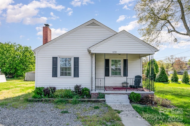 630 S Myrtle School Rd, Gastonia, NC 28052 - bungalow-style house featuring a front yard, a chimney, and a porch