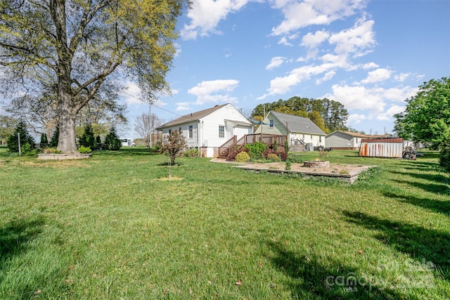 630 S Myrtle School Rd, Gastonia, NC 28052 - view of yard with an outdoor structure, a deck, and a shed