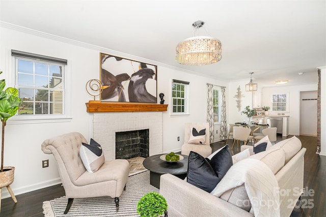 630 S Myrtle School Rd, Gastonia, NC 28052 - living room with ornamental molding, dark wood-style floors, a notable chandelier, and baseboards