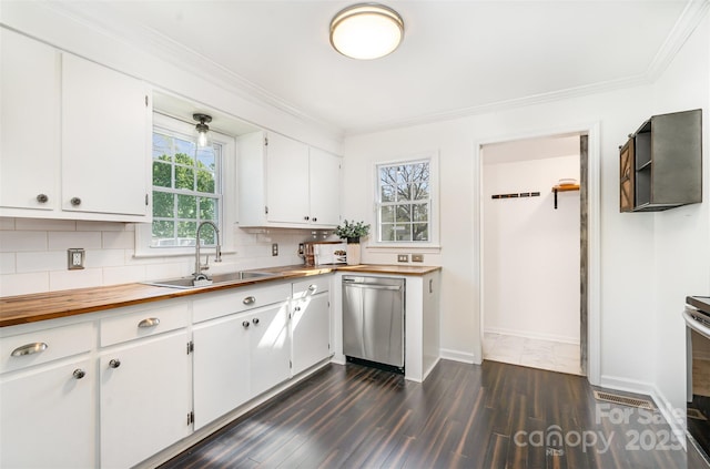 630 S Myrtle School Rd, Gastonia, NC 28052 - kitchen featuring butcher block counters, appliances with stainless steel finishes, white cabinets, backsplash, and a sink
