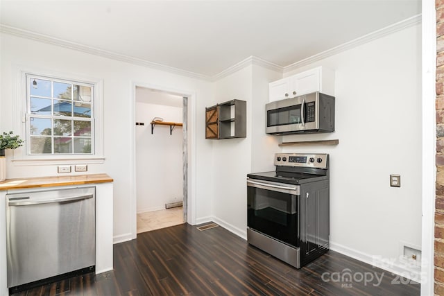 630 S Myrtle School Rd, Gastonia, NC 28052 - kitchen featuring dark wood-style floors, butcher block countertops, white cabinets, and stainless steel appliances