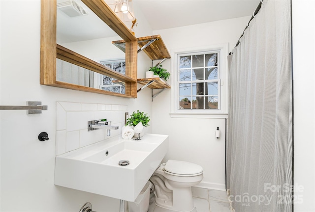 630 S Myrtle School Rd, Gastonia, NC 28052 - full bathroom with a shower with curtain, a sink, toilet, marble finish floor, and visible vents