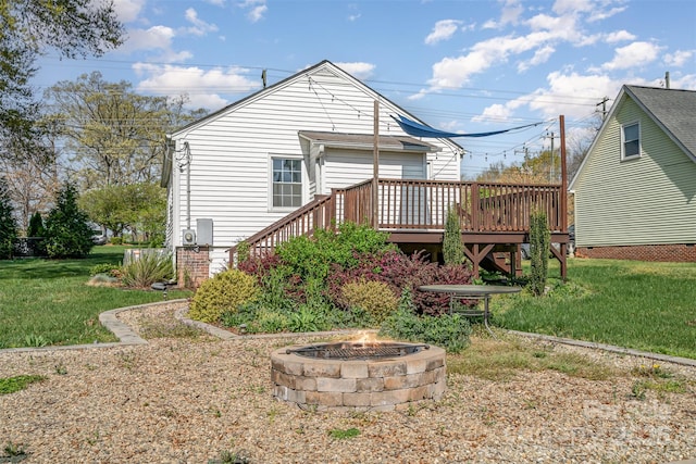630 S Myrtle School Rd, Gastonia, NC 28052 - rear view of house featuring a wooden deck, a yard, and a fire pit