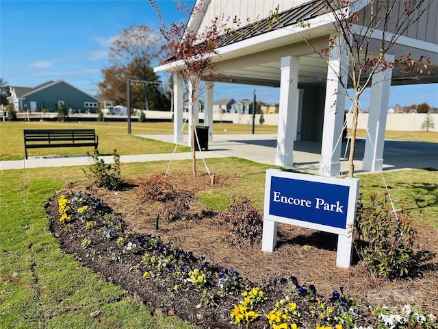 view of property's community with a lawn