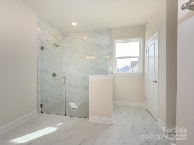 bathroom featuring marble finish floor, baseboards, recessed lighting, and a marble finish shower
