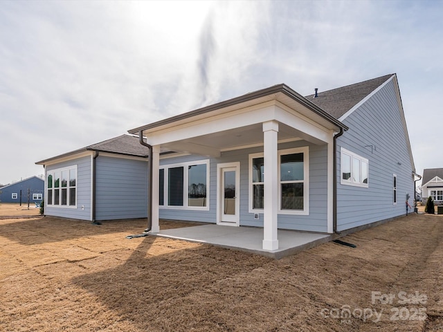 rear view of property featuring a patio