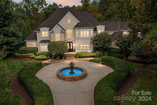 view of french country inspired facade