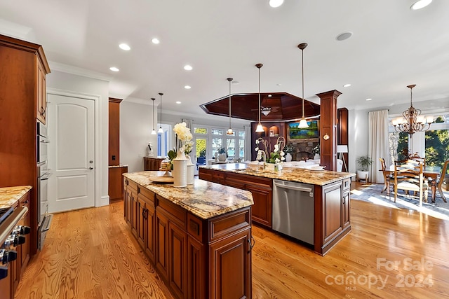 kitchen featuring dishwasher, a center island with sink, and hanging light fixtures