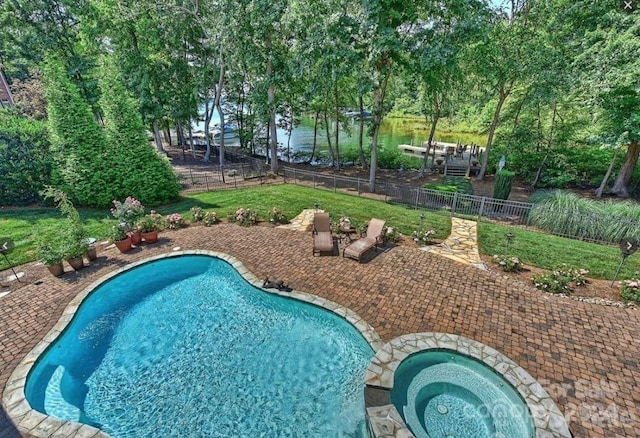 view of pool featuring an in ground hot tub and a patio area