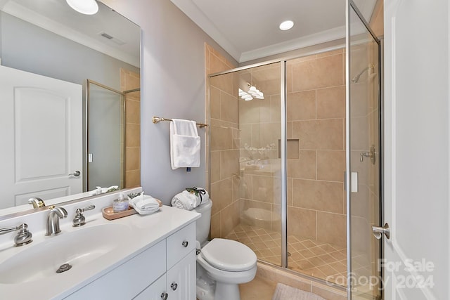 bathroom featuring crown molding, a shower with door, toilet, and vanity