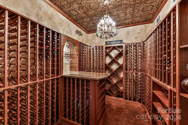 wine area with an inviting chandelier and crown molding