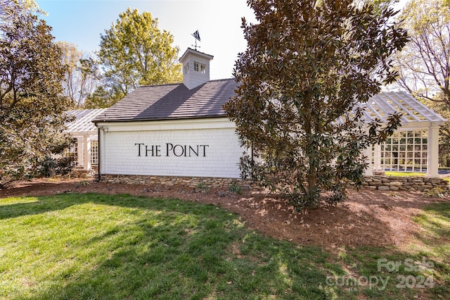 view of side of home featuring a lawn