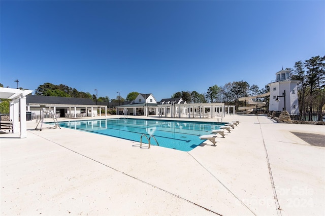 view of pool featuring a patio