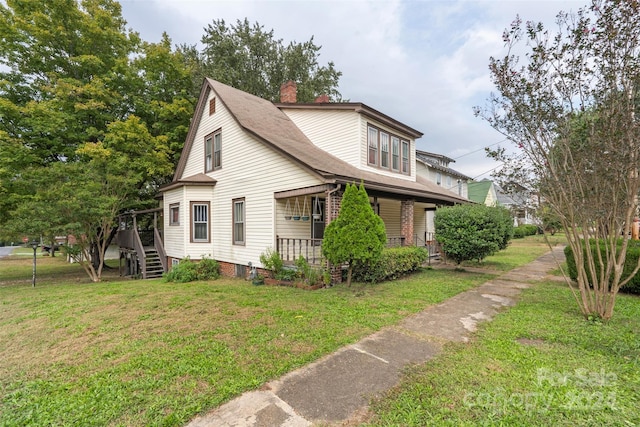 view of home's exterior with a yard