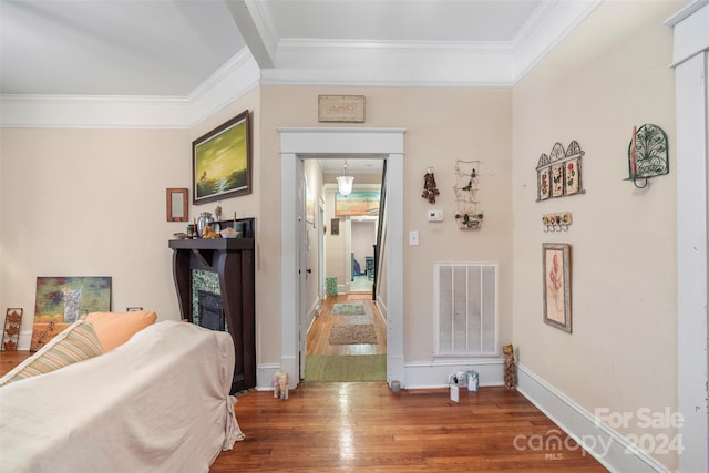 bedroom featuring hardwood / wood-style flooring and ornamental molding