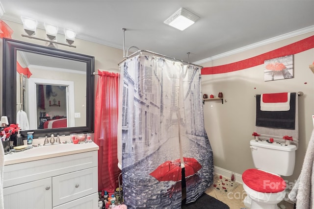 bathroom featuring ornamental molding, vanity, and toilet