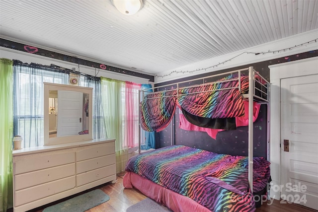 bedroom with hardwood / wood-style floors