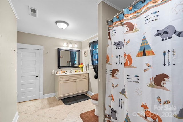 bathroom with vanity, walk in shower, crown molding, tile patterned flooring, and toilet