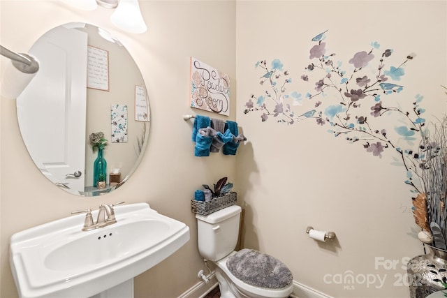 bathroom featuring sink and toilet