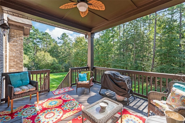 wooden terrace with outdoor lounge area and ceiling fan