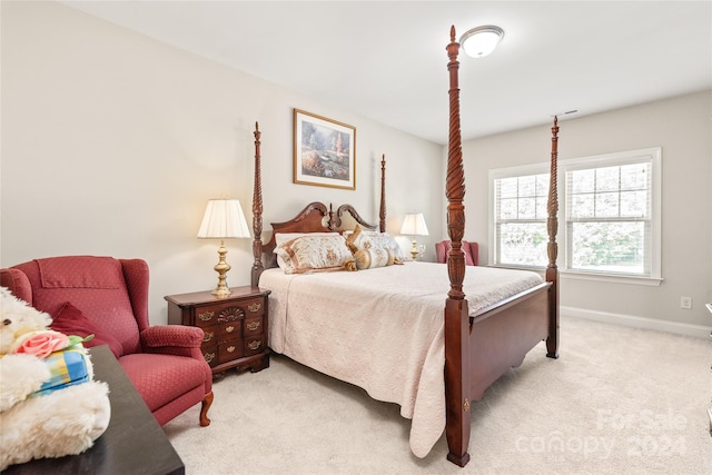 bedroom with light colored carpet