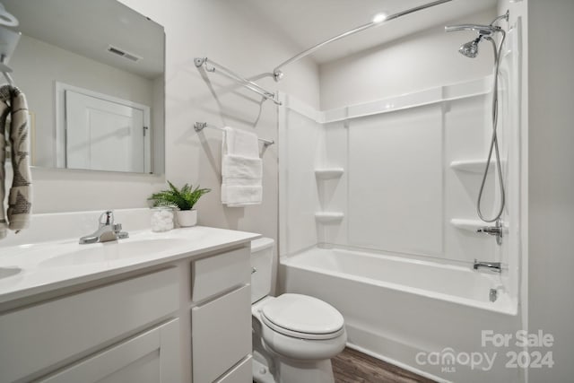 full bathroom featuring shower / tub combination, vanity, toilet, and hardwood / wood-style flooring