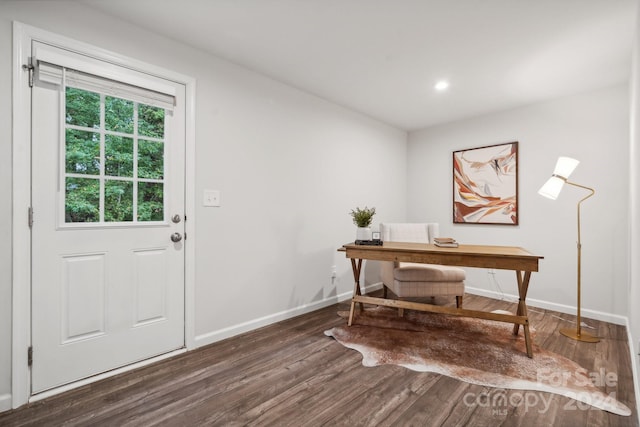 home office with dark hardwood / wood-style floors