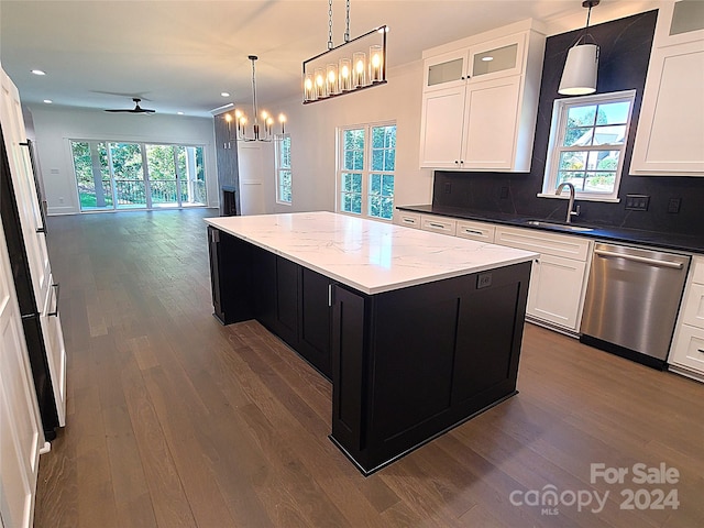 kitchen featuring a center island, a wealth of natural light, dark hardwood / wood-style floors, and dishwasher