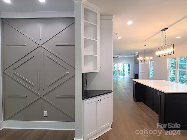 interior space with a center island and dark hardwood / wood-style flooring