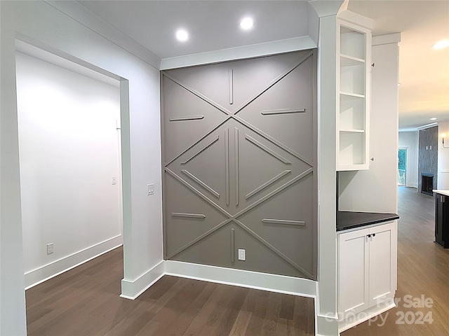 interior details featuring hardwood / wood-style flooring and a fireplace