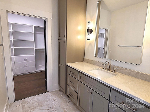 bathroom featuring vanity and hardwood / wood-style flooring